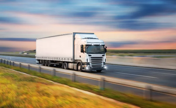 depositphotos_212828960-stock-photo-truck-with-container-on-road.jpg
